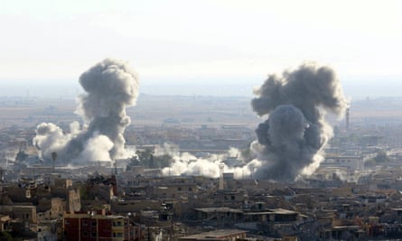 Direct hit: smoke rises from the site of US-led air strike on Sinjar in November 2015.