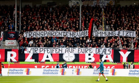 fans display a banner in protest