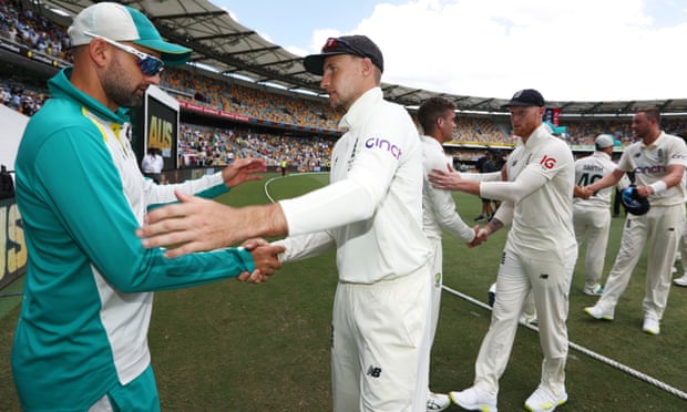 England captain shakes hands with Nathan Lyon, left, after Australia’s resounding victory in the first Test