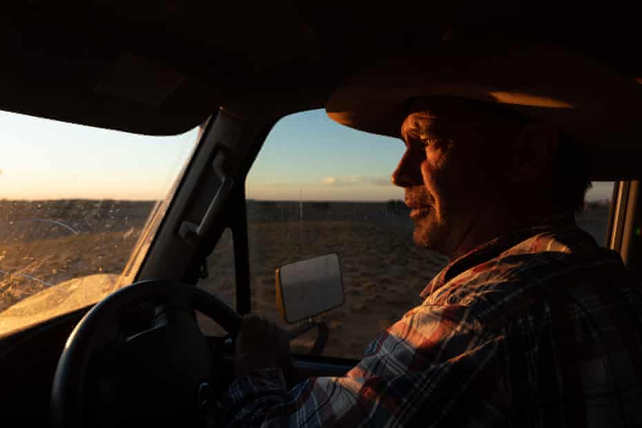 Kidd drives his vehicle across his property at dusk