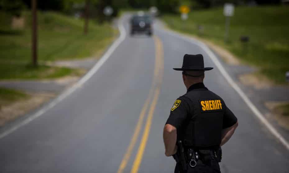 An officer works a checkpoint on 14 June 2015 in Cadyville, New York