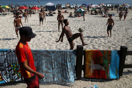 People play football at Ipanema beach in Rio last week.