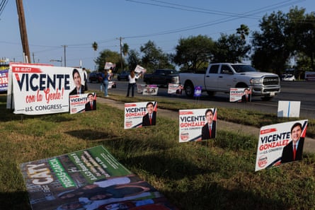 campaign signs on a lawn
