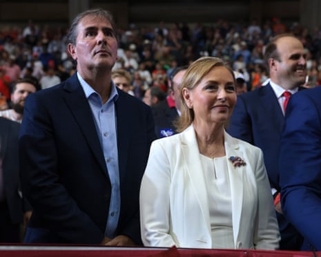 Senate nominee Darline Graham and husband Larry Nordone stand in a crowd, looking upward
