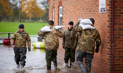 Soldiers drop sandbags in South Yorkshire, where the Environment Agency warned of continued problems.