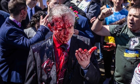 Russian Ambassador to Poland, Ambassador Sergey Andreev reacts after being covered with red paint during a protest in Warsaw, May 2022.
