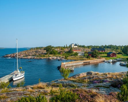 Small harbour, sailing boat and Jetty.