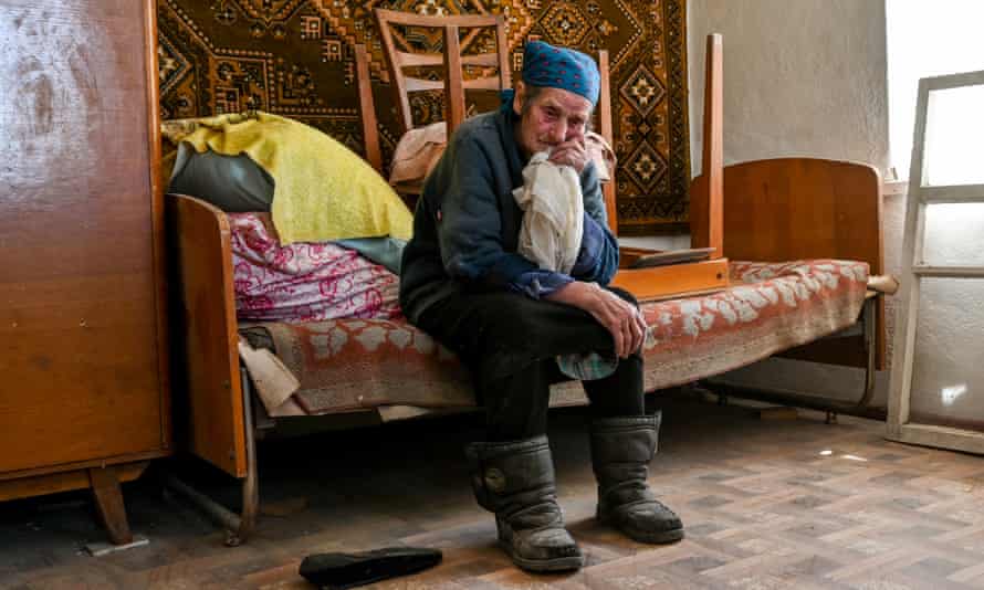 A Ukrainian woman in her house after the 18 missiles hit the civil settlements of Komyshuvakha, Zaporizhzhia Oblast, Ukraine, on Tuesday.