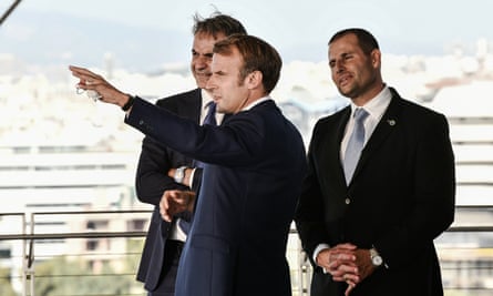 The Greek prime minister, Kyriakos Mitsotakis (left), speaks with the French president, Emmanuel Macron (centre), and Malta’s prime minister, Robert Abela, on the sidelines of the EUMed9 Summit, in Athens