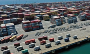 Coronavirus live news: London enters tier 3 restrictions; Trump will 'absolutely' encourage vaccine use | World news 5 Containers are seen on a shipping dock in the Port of Los Angeles, California.