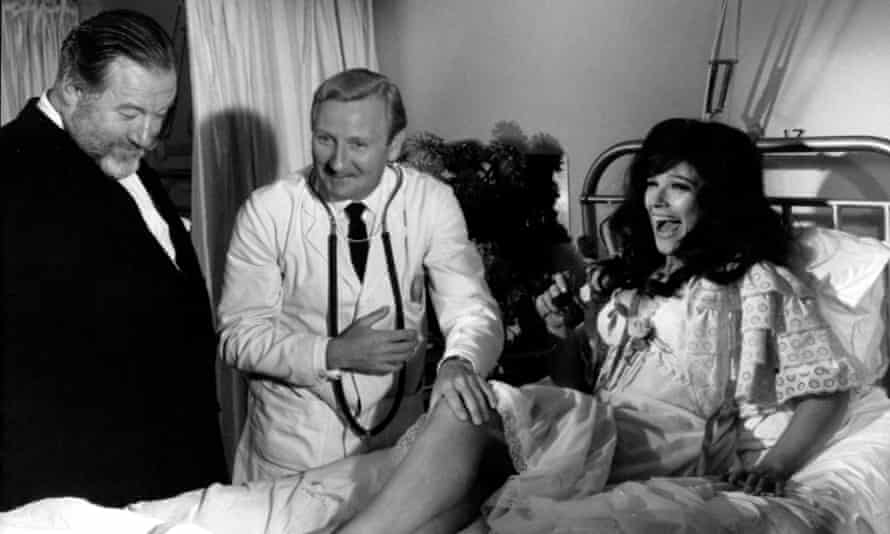 Fenella Fielding with James Robertson Justice, left, and Leslie Phillips in Doctor in Clover, 1966.