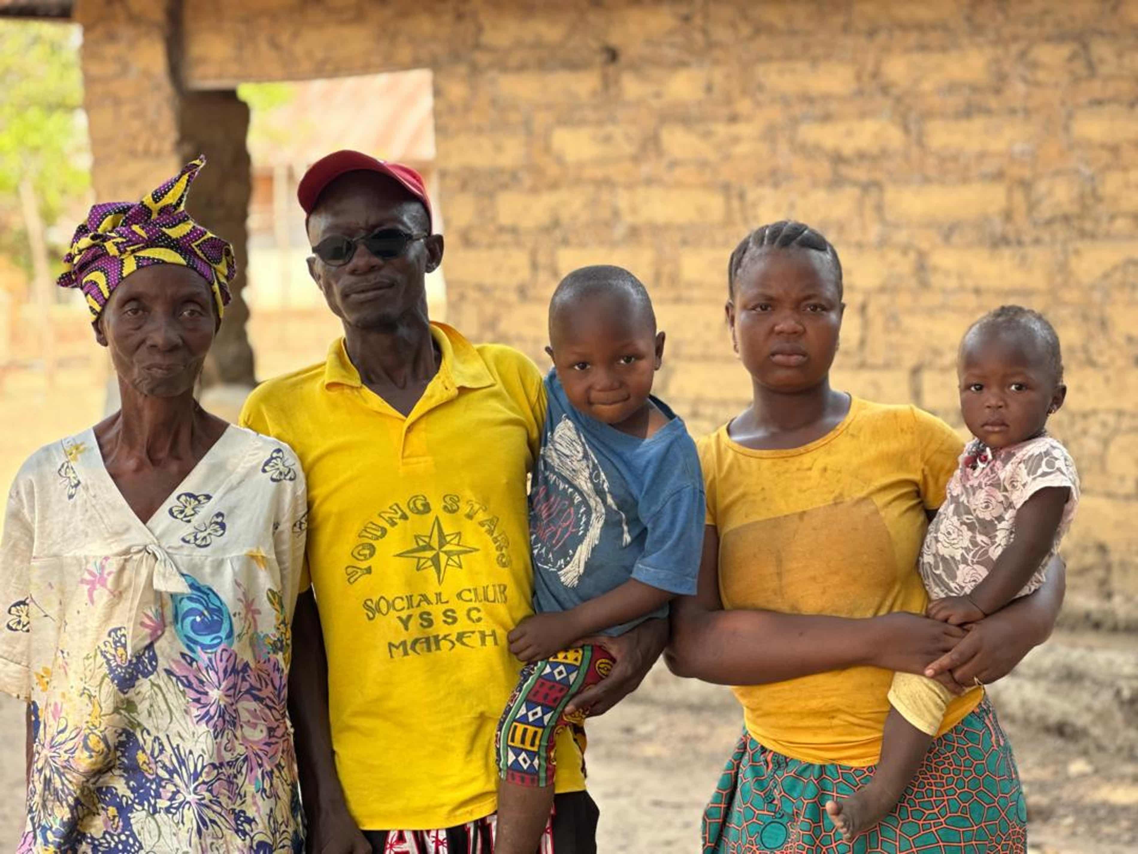 Tarawallie with his mother, wife and children. Until the cuts he worked on disease-prevention projects tackling onchocerciasis, lymphatic filariasis and malaria. Photograph: Alpha Sesay/courtesy of Helen Keller Intl.