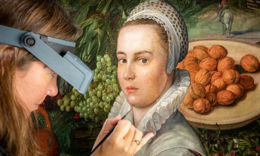 A restorer at work on the work, now thought to be by the 16th-century Flemish painter Joachim Beuckelaer.