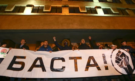 People in Minsk hold a banner that reads ‘Basta!’ (Enough).