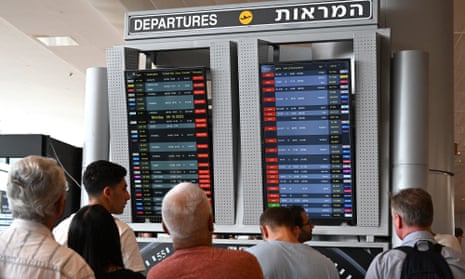 Passengers check for cancelled flights at Ben Gurion Airport, Israel