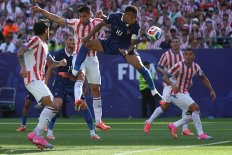 Kylian Mbappe rises with Diego Gomez