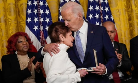 Joe Biden embraces Gladys Sicknick, mother of late Capitol Police officer Brian Sicknick, as she accepts a Presidential Citizens Medal on behalf of her late son at the White House Friday.