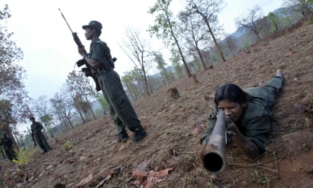 Members of Naxalites, officially the Communist Party of India (Maoist), exercise at a temporary base in the Abujh Marh forests, Chhattisgarh, 2007.