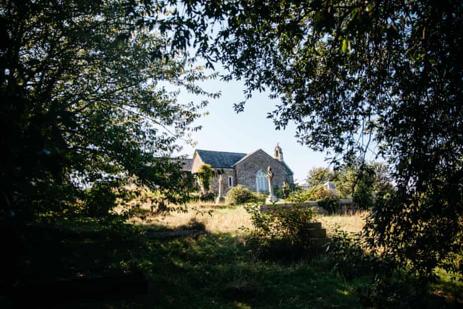 A view of an old church through some trees