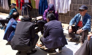 Men hawk cheap second-hand watches, jewellery and clothes outside Tapgol Park in Seoul.