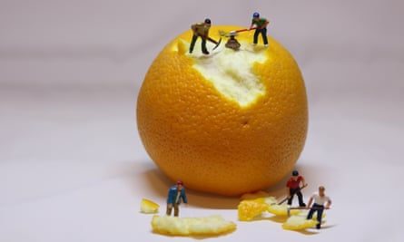 Close-Up Of Figurines With Orange Against White BackgroundGettyImages-950086224