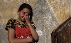 A relative of Palestinian Mahmoud Abu Taima, who was killed during a protest at the Israel-Gaza border, mourns during his funeral