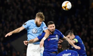 Malmo’s Rasmus Bengtsson beats Chelsea’s Olivier Giroud in the air.