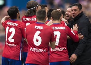 Atlético celebrate with Diego Simeone during their win.