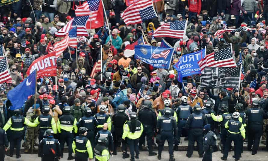 Trump supporters clash with police and security forces as they storm the US Capitol in Washington DC, on 6 January 2021.