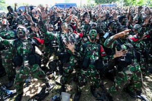 Jantho, Indonesia. Soldiers from the Iskandar Muda military command sing after finishing a military exercise