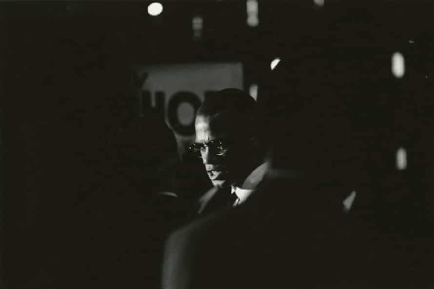 Malcolm X, pictured in Harlem in 1964.
