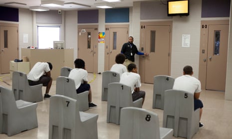 Juvenile offenders wait to go to the gym inside the Juvenile Detention Center, in Toledo, Ohio. 