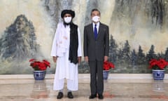 Mullah Abdul Ghani Baradar, left, the Taliban co-founder, and the Chinese foreign minister, Wang Yi, meeting in Tianjin, China, on Wednesday.