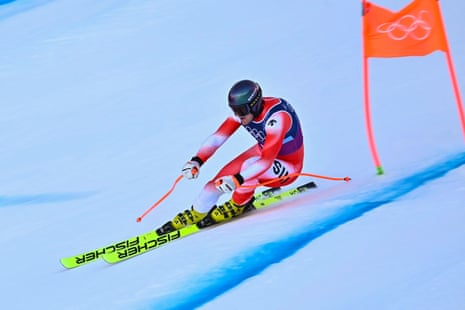 Switzerland's Stefan Rogentin speeds past a gate.