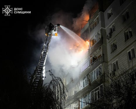 A firefighter works at the site of an apartment building hit during a Russian drone strike, amid Russia’s attack on Ukraine, in Sumy, Ukraine.
