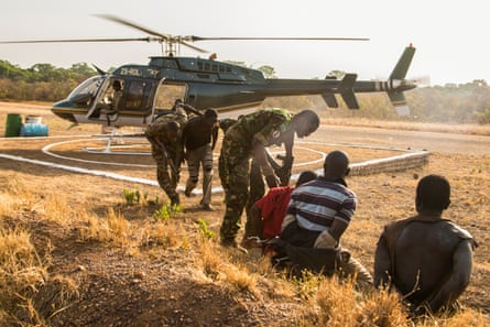 Suspected poachers caught in Chinko arrive at the park’s main base. Rangers put them in handcuffs, sit them down together, then take them to a holding cell. The moment is the culmination of a week-long operation by Chinko’s law-enforcement and aerial patrol teams.