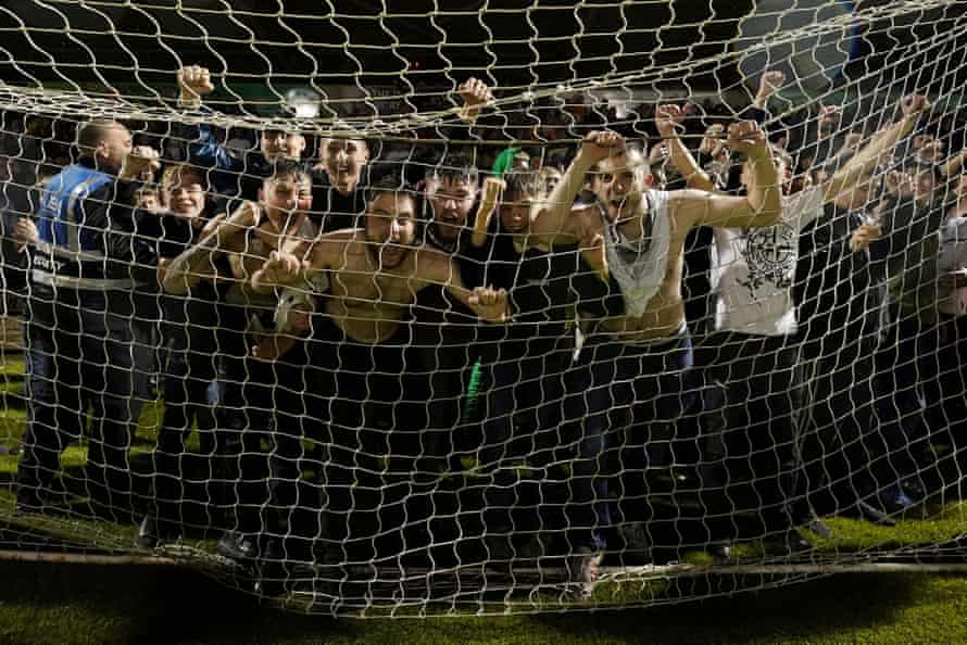 Mansfield fans celebrate at full time.