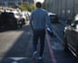 A former inmate walks along a road