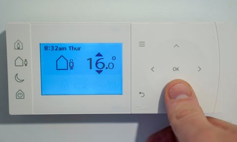 A person using a thermostat