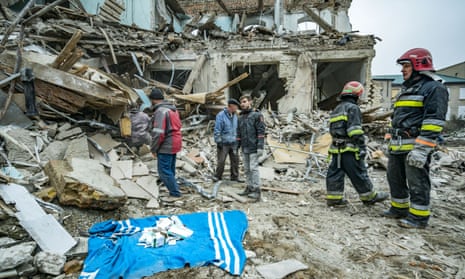 Rescuers search for medicines in the destroyed maternity ward of Vilniansk hospital, after it was struck by a Russian missile. One newborn was killed in the attack