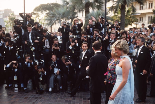 Prince Charles and Diana, Princess of Wales, are photographed arriving at the Cannes film festival, 1987.
