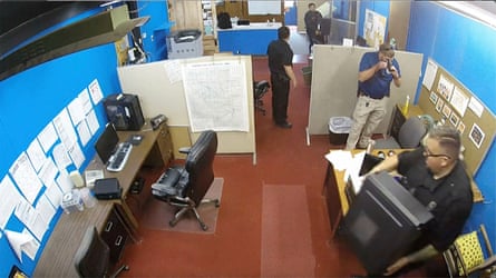 This surveillance video shows Marion police department confiscating computers and cellphones from the publisher and staff of the Marion County Record.