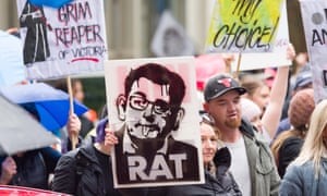 Protesters march in the central business district of Melbourne, Australia, against proposed state government legislation governing pandemic management powers.
