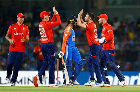 Mark Wood celebrates with Harry Brook after taking the wicket of India’s Abhishek Sharma