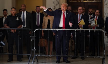 donald trump outside court behind a barrier