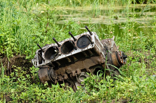 The remains of a Russian tank engine beside the Irpin in Rakivka.