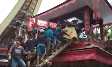 A funeral procession in Sulawesi, Indonesia. A man has died after his mother’s coffin fell from a funeral tower and crushed him.