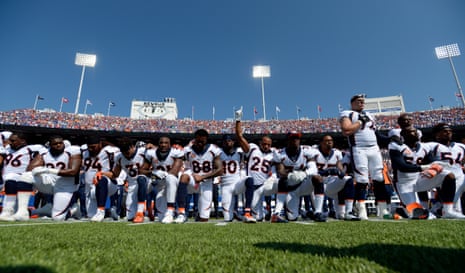 The Denver Broncos take a knee during the national anthem before their game against the the Buffalo Bills on 24 September at New Era Field in Orchard Park in New York