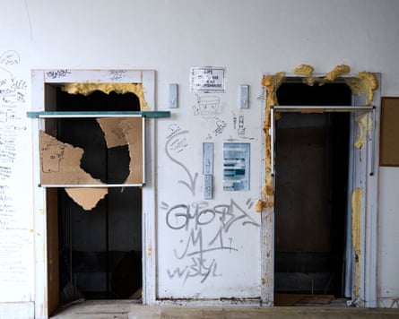 Two damaged doorways surrounded in graffiti