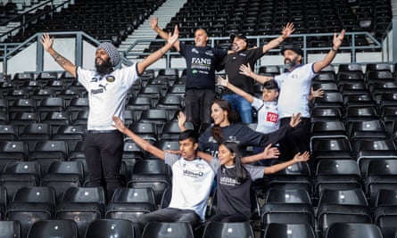 Members of the Punjabi Rams football supporters' club in the East Stand of Derby County’s Pride Park ground. Pictured clockwise from left - Vik Singh Dosanjh, Balbir Singh Samra, Jaz Basra, Kal Singh Dhindsa with son Raman(8years), Reena Talwar with son Kian(13 years) and Jaya(10)